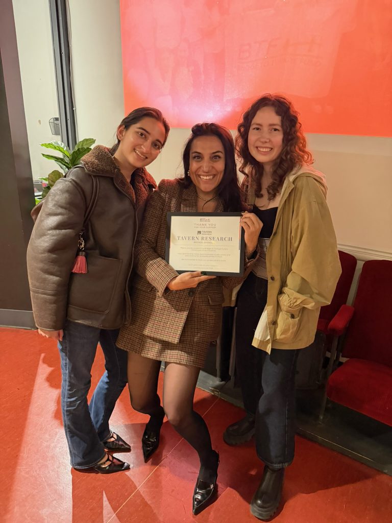 Chicago volunteers posing with Tavern Research's sponsorship certificate